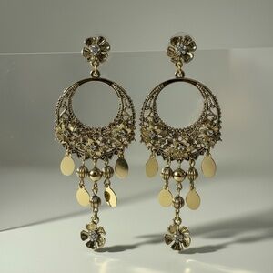 Gold toned chandelier earrings with charms
